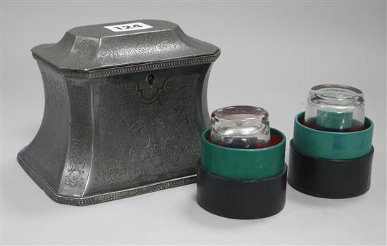 A Britannia metal tea caddy and two leather cased measures